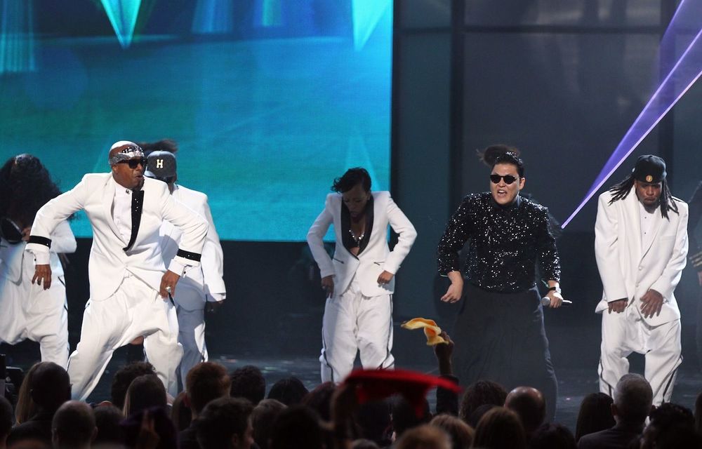 Psy performing with MC Hammer at the American Music Awards.