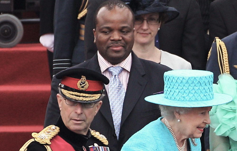 Queen Elizabeth II walks past King Mswati III of Swaziland as she attends the Armed Forces Parade and Muster in Home Park on May 19.