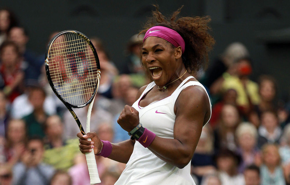 Serena Williams reacts after winning her quarterfinal match against Petra Kvitova on day eight of the Wimbledon Championships.