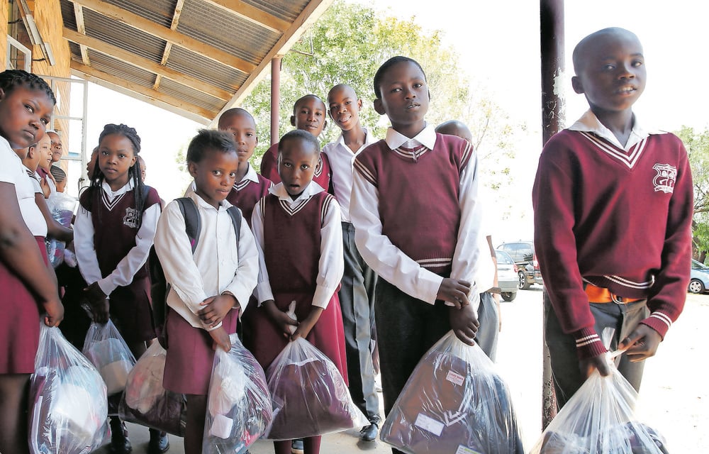 Various organisations work the Gauteng department of social development to provide school backpacks