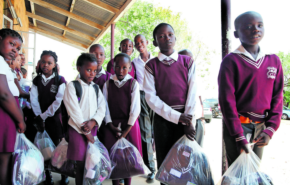 Various organisations work the Gauteng department of social development to provide school backpacks