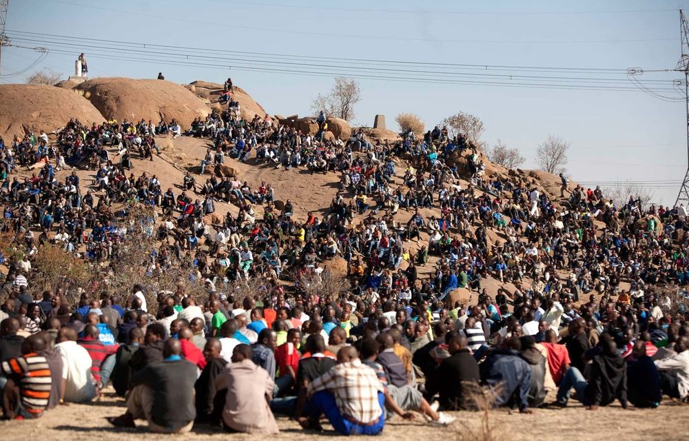 Miners gather on a koppie near the Lonmin mines.