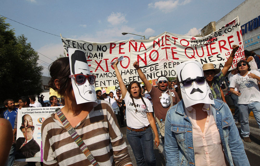 Students belonging to the 132 movement march towards the second presidential debate site in Guadalajara