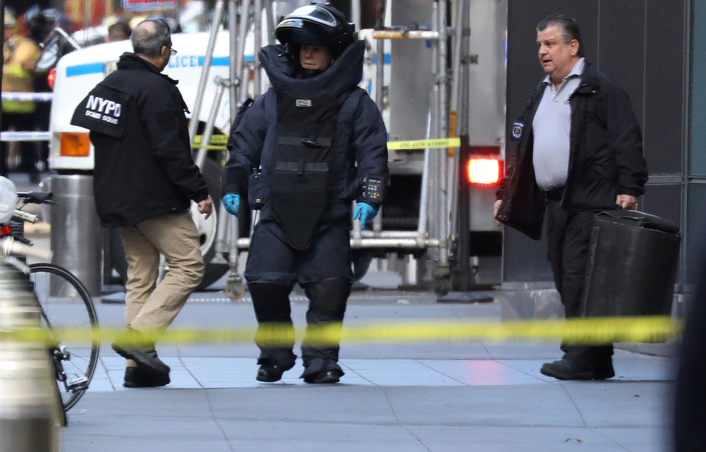 A member of the New York Police Department bomb squad is pictured outside the Time Warner Center in the Manhattan borough of New York City after a suspicious package was found inside the CNN Headquarters in New York.