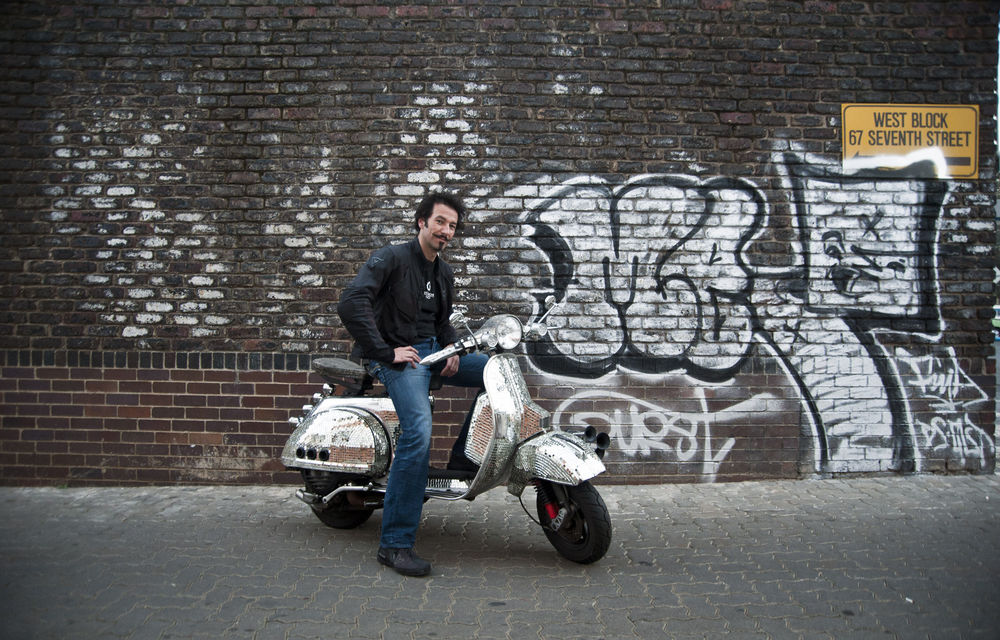 All that glitters: Artist Yiull Damaso customised his Vespa by covering it with 43kg of mirror fragments.