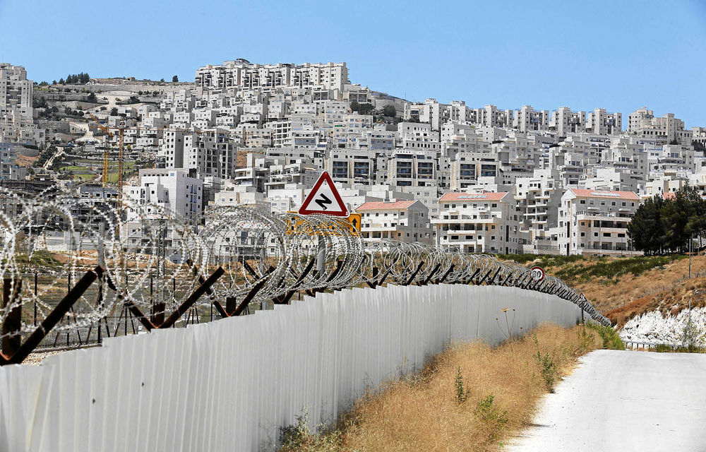 The wall between Israel and Palestine.