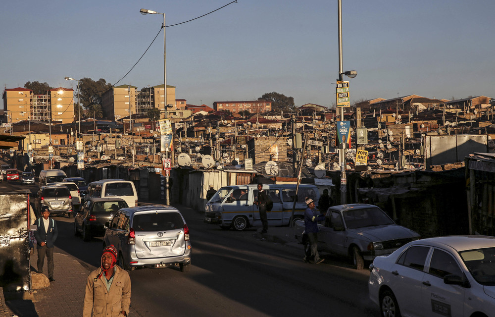 Congested: People live on top of one another in shacks and backyards. The population pressure has resulted in sewage flowing in the streets.