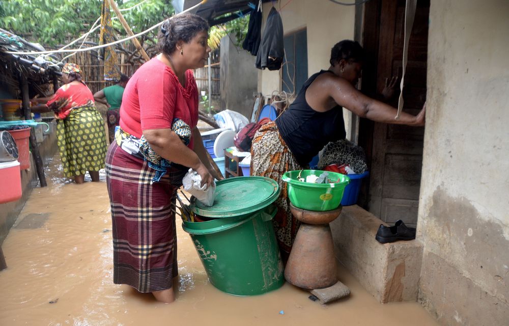 Residents try to salvage their belongings in the Paquite district of Pemba