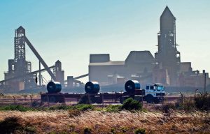 ArcelorMittal says it plans to mitigate further losses by cutting jobs and focusing on improving cash flows.