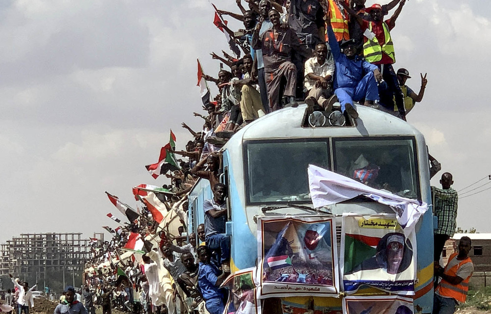 Initial victory: Sudan’s citizens celebrate the power sharing deal.