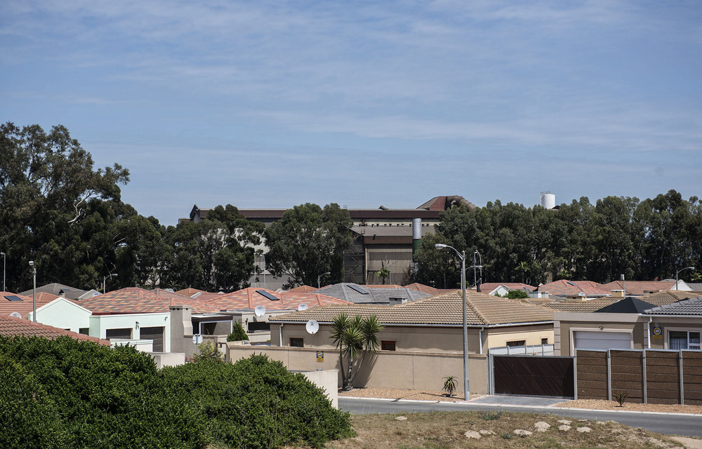 Dirty backdrop: The Cisco factory can be seen behind this housing estate in Kuils River.