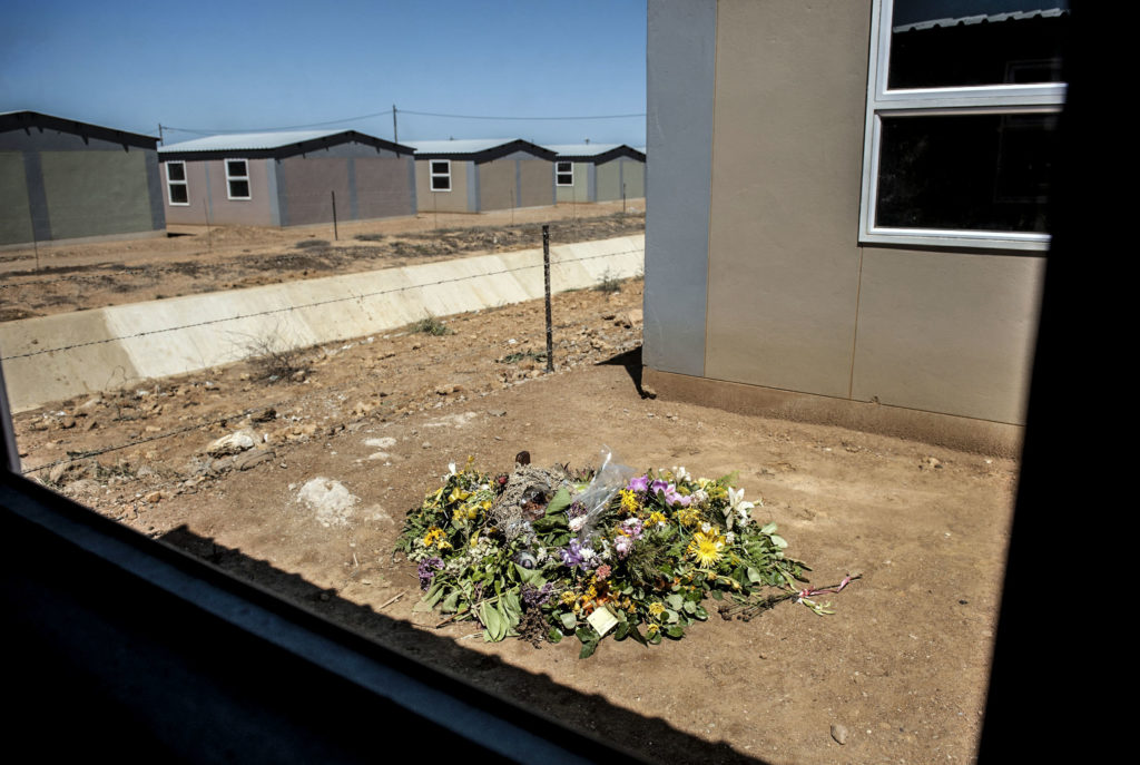 Flowers mark the place where Anene Booysen was raped and murdered in Bredasdorp in 2013