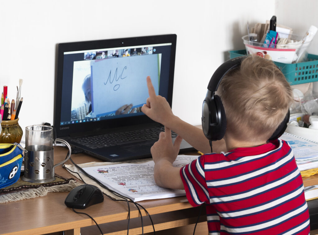 First Grader Alexey Seen During An Online Lesson.online