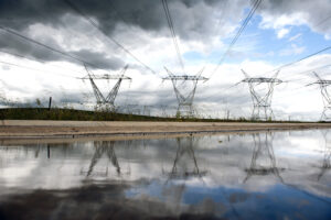 Electricity Power Lines Running Through The Countryside Outside Of Cape Town.