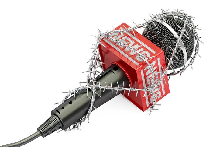 Freedom Of Press Prohibition Concept. Microphone With Barbed Wire, 3d Rendering Isolated On White Background