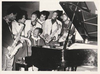 Musicians (l R) Basil Coetzee, Pat Matshikiza, Selby Ntuli, Producer Rashid Vally, Sipho Mabuse, Alec Khaoli, Kippie Moketsi (seated) Tshona! Session, Gallo Studios 1975 (as Shams Archive)