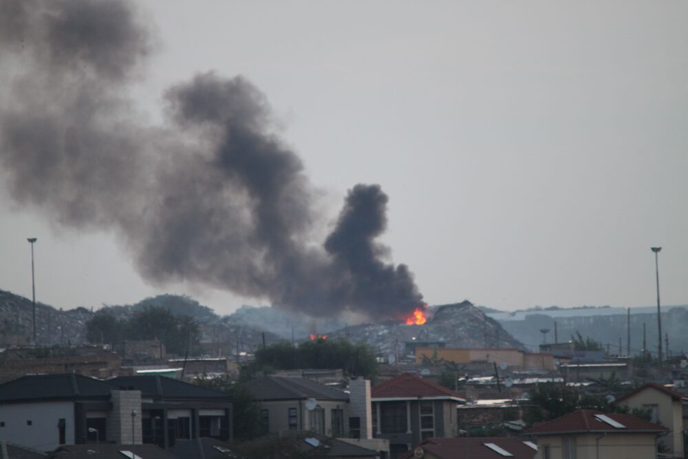 Kyasandmainillegaldumpburningfromcedarcreek